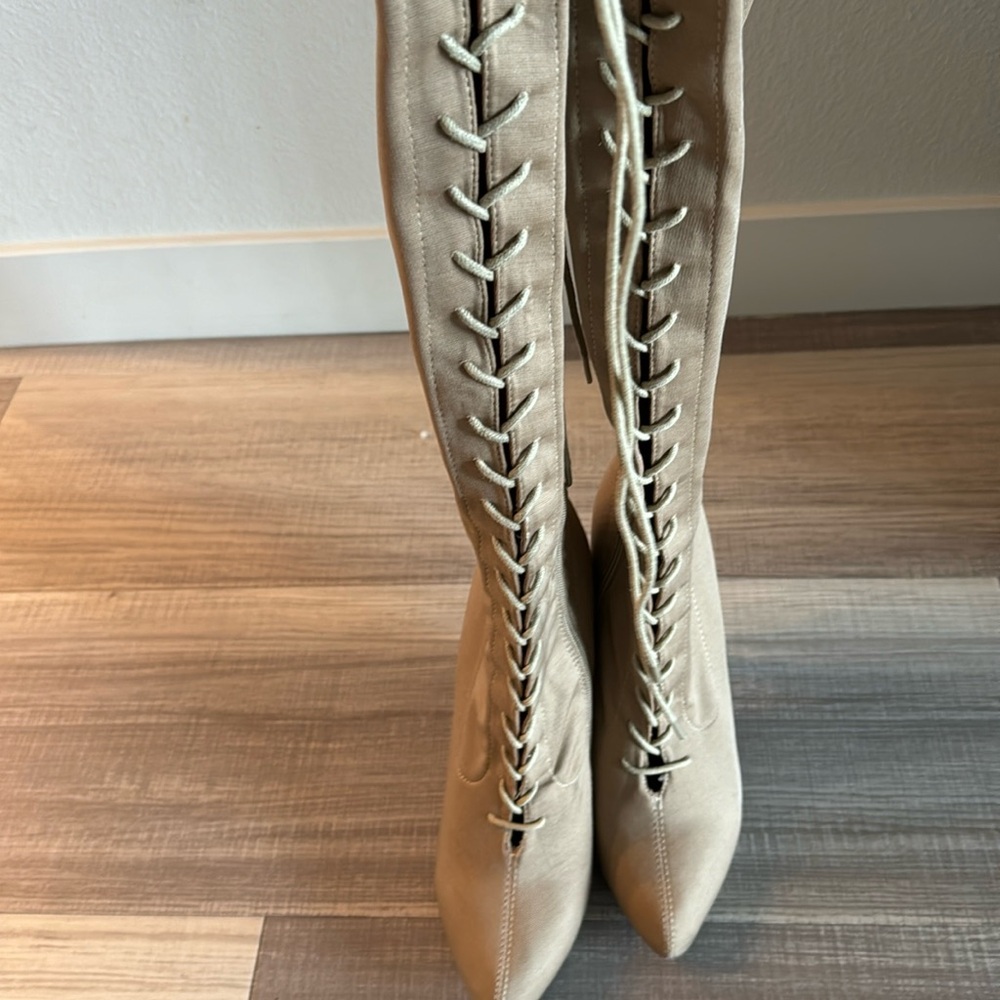 Thigh high lace up heeled boots